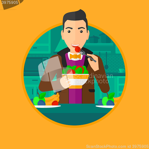 Image of Man eating healthy vegetable salad.