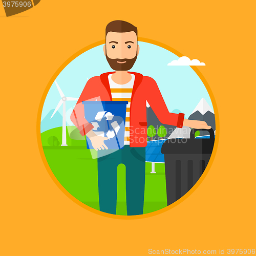 Image of Man with recycle bin and trash can.