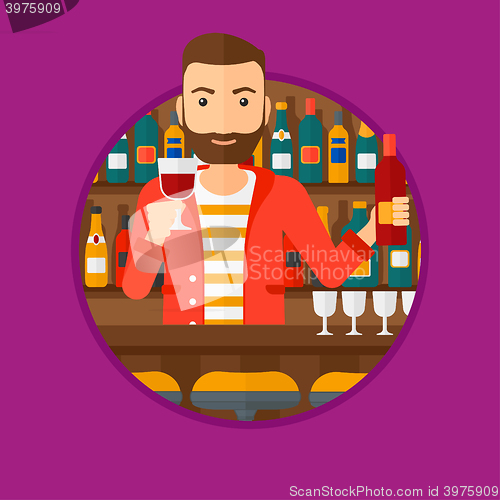 Image of Bartender standing at the bar counter.