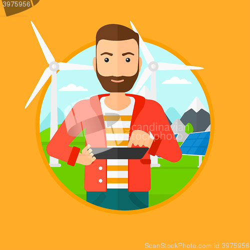 Image of Male worker of solar power plant and wind farm.