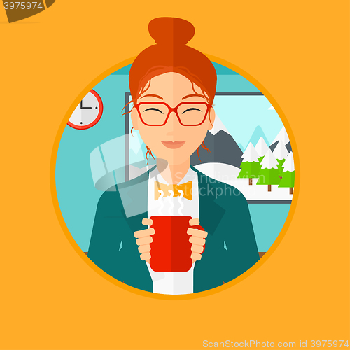 Image of Woman enjoying cup of hot coffee.