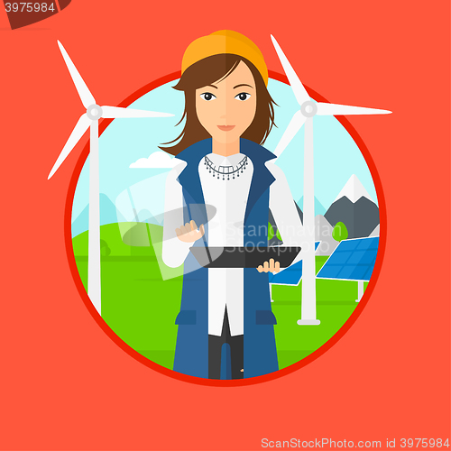 Image of Female worker of solar power plant and wind farm.