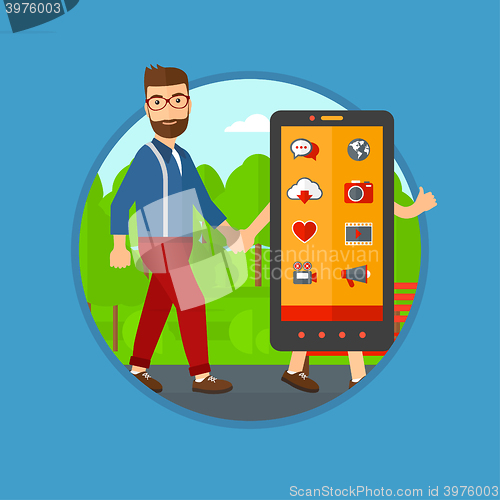 Image of Man walking with big smartphone.