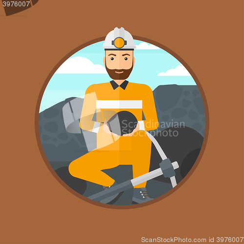 Image of Miner holding coal in hands.