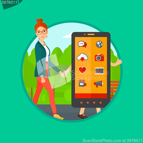 Image of Woman walking with smartphone.