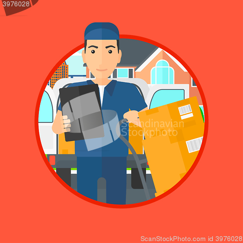 Image of Delivery man with cardboard boxes.