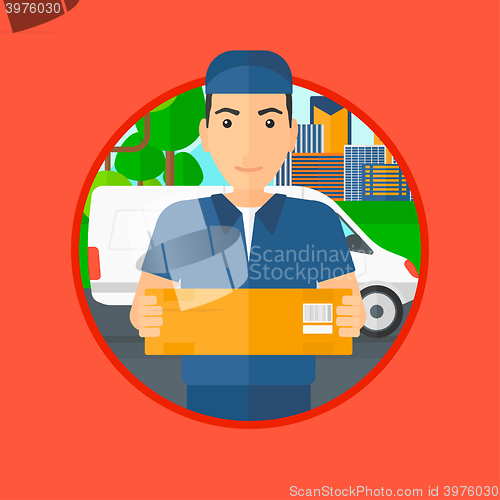 Image of Delivery man carrying cardboard boxes.