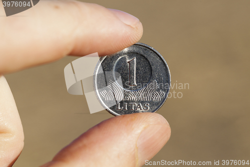 Image of coin in hand  