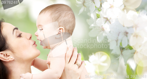 Image of happy mother kissing adorable baby