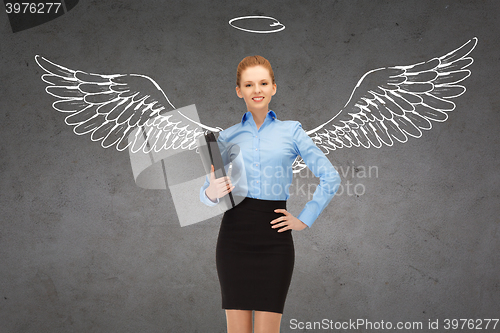 Image of happy businesswoman with angel wings and nimbus