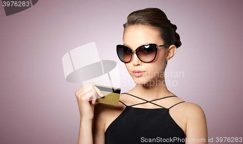 Image of beautiful young woman in elegant black sunglasses