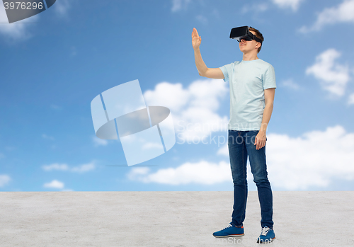 Image of happy man in virtual reality headset or 3d glasses