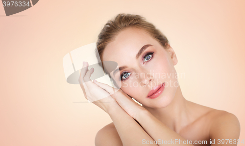 Image of beautiful young woman face and hands