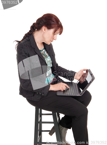 Image of Woman working on her laptop.