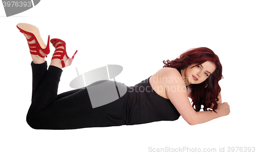Image of Lovely woman lying on floor.