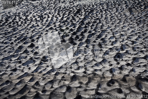 Image of Black snow 1. Direct allegory of human pollution of the Earth. Concept of combining opposite