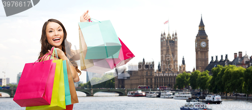 Image of woman with shopping bags over london city