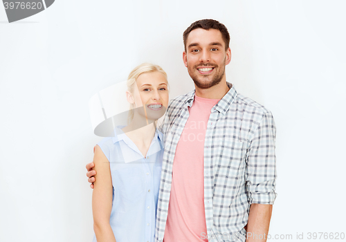 Image of smiling couple hugging