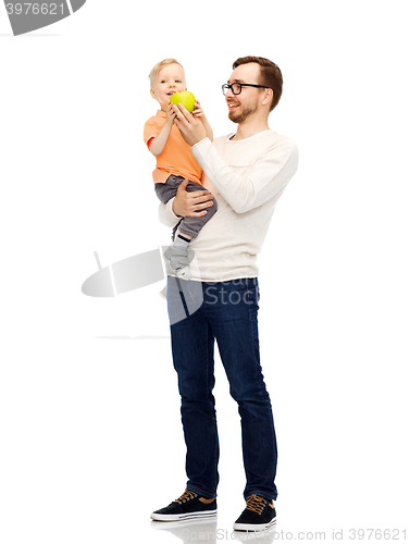 Image of happy father and little son with green apple