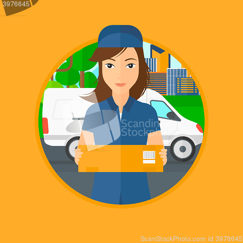 Image of Delivery woman carrying cardboard boxes.