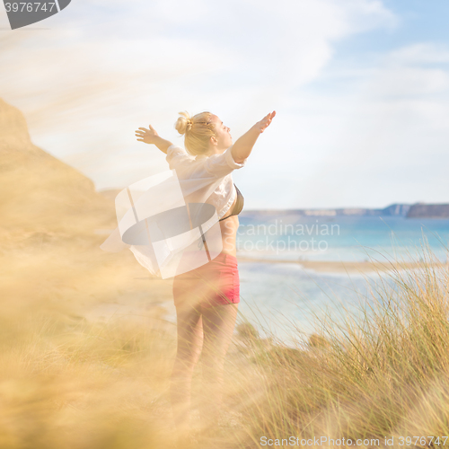 Image of Free Happy Woman Enjoying Sun on Vacations.