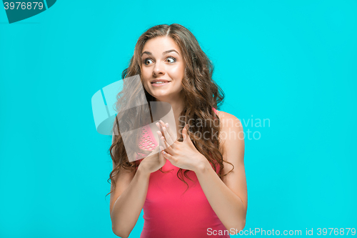 Image of Portrait of young woman with shocked facial expression