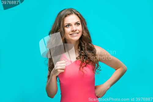 Image of Portrait of young woman with shocked facial expression