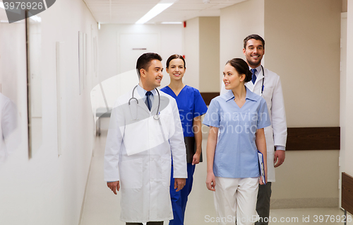 Image of group of happy medics or doctors at hospital