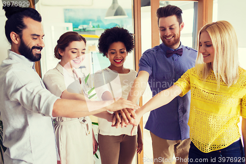 Image of happy creative team in office