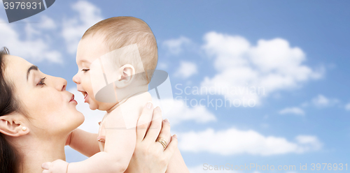Image of happy mother kissing adorable baby