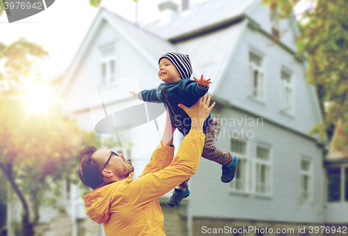 Image of father with son playing and having fun outdoors