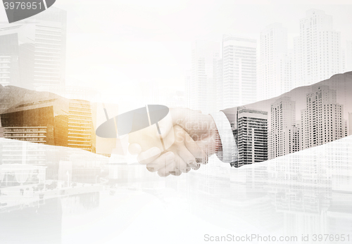 Image of businessman and businesswoman shaking hands