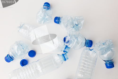 Image of close up of empty used plastic bottles on table