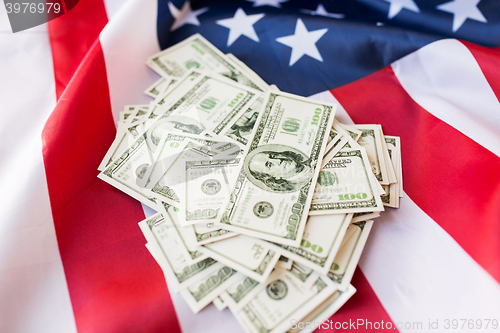 Image of close up of american flag and dollar cash money