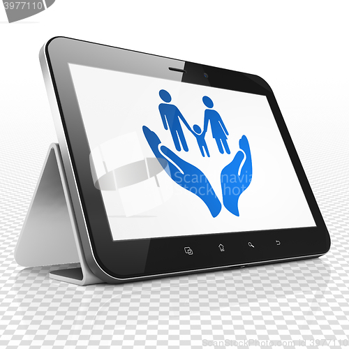 Image of Insurance concept: Tablet Computer with Family And Palm on display