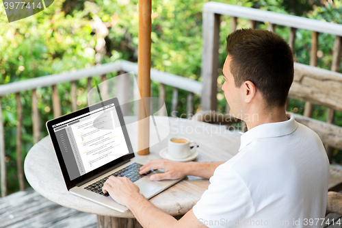 Image of close up of businessman with laptop on terrace