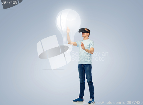 Image of happy man in virtual reality headset or 3d glasses