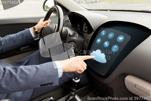 Image of close up of man driving car with menu on computer