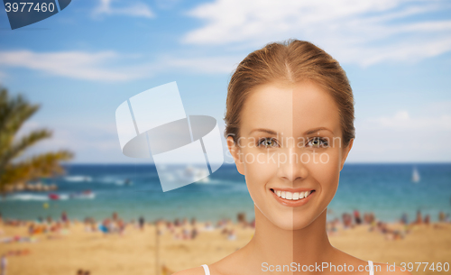 Image of close up of beautiful woman with half face tanned