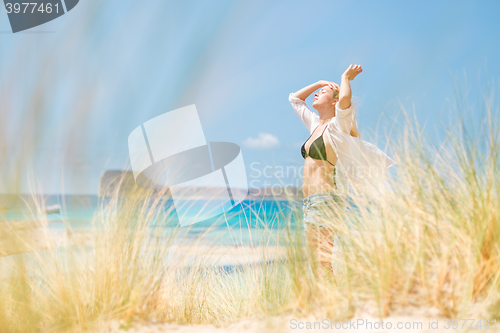 Image of Free Happy Woman Enjoying Sun on Vacations.