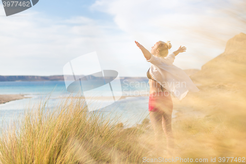 Image of Free Happy Woman Enjoying Sun on Vacations.