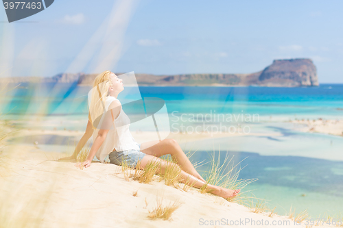 Image of Relaxed Happy Woman Enjoying Sun on Vacations.