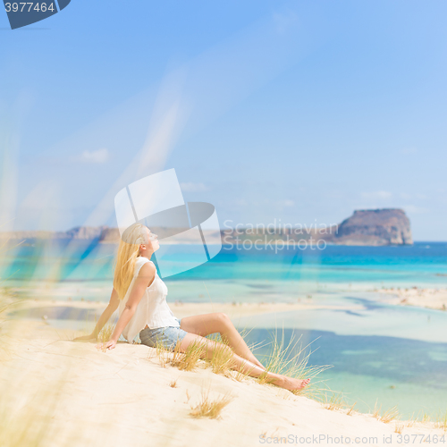 Image of Relaxed Happy Woman Enjoying Sun on Vacations.