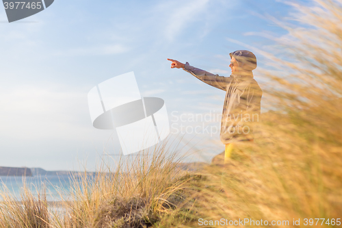 Image of Free active man enjoying beauty of nature.