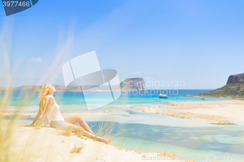 Image of Relaxed Happy Woman Enjoying Sun on Vacations.