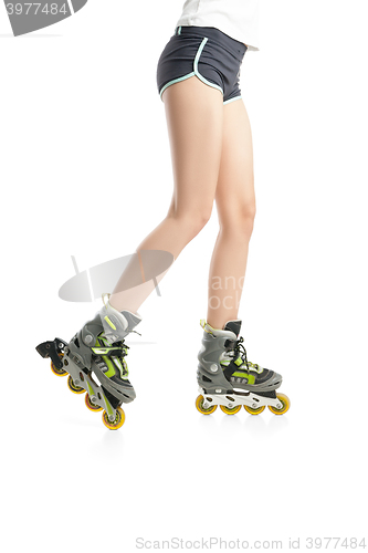 Image of Close up  picture of woman\'s legs with rollerskates 