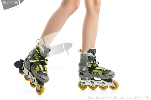 Image of Close up  picture of woman\'s legs with rollerskates 