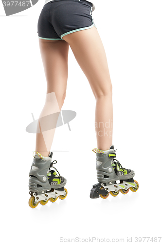 Image of Close up  picture of woman\'s legs with rollerskates 