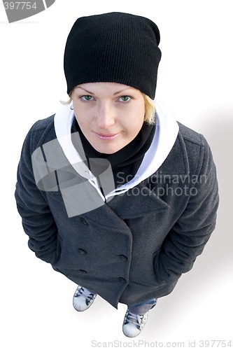 Image of girl in cap, coat and gym shoes
