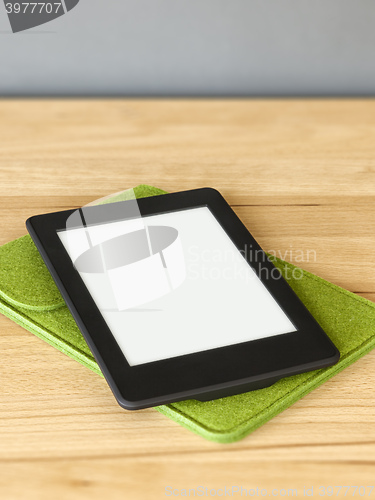 Image of ebook reader on a wooden table